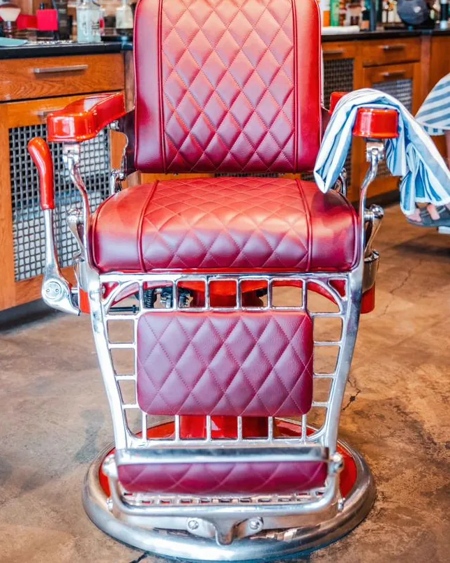 A red leather barber chair