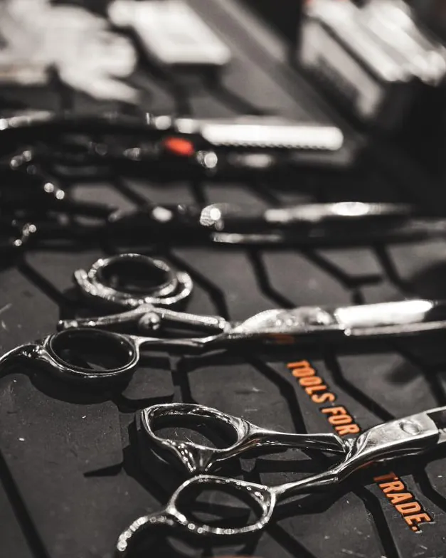 Barber shears laid out on a mat